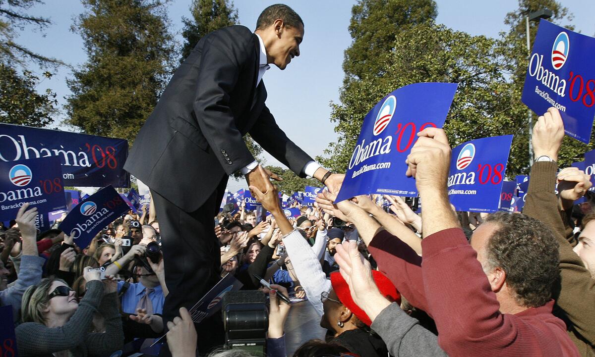 Then-presidential candidate Barack Obama greets supporters during a rally at Rancho Cienega Sports Complex on Rodeo Road in 2007.