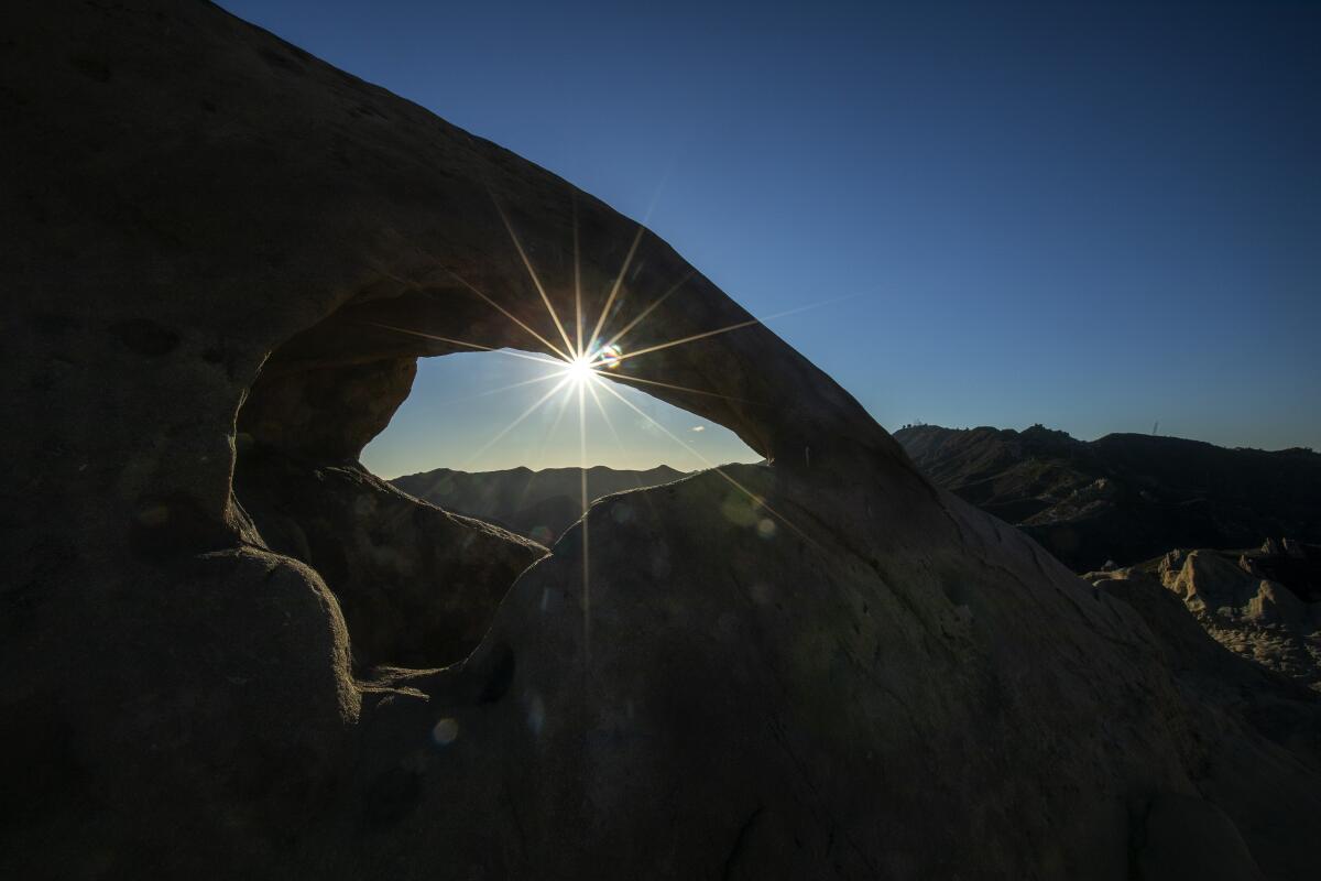 The suns sets behind the Santa Monica Mountains along the Backbone Trail in Corral Canyon.