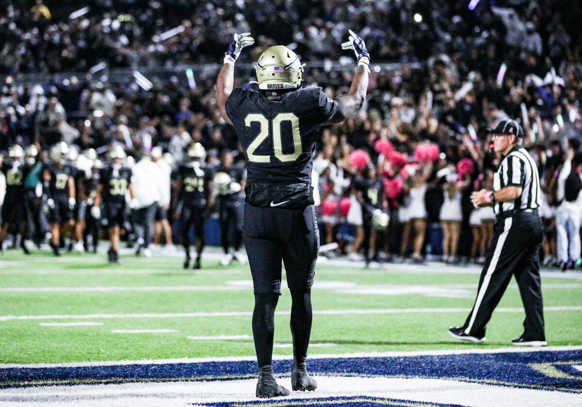 Cameron Jones of St. John Bosco faces the crowd in celebration.