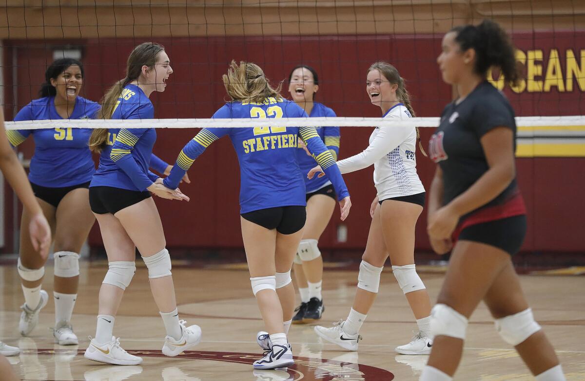 The Fountain Valley girls' volleyball team celebrates a point against Ocean View on Monday.