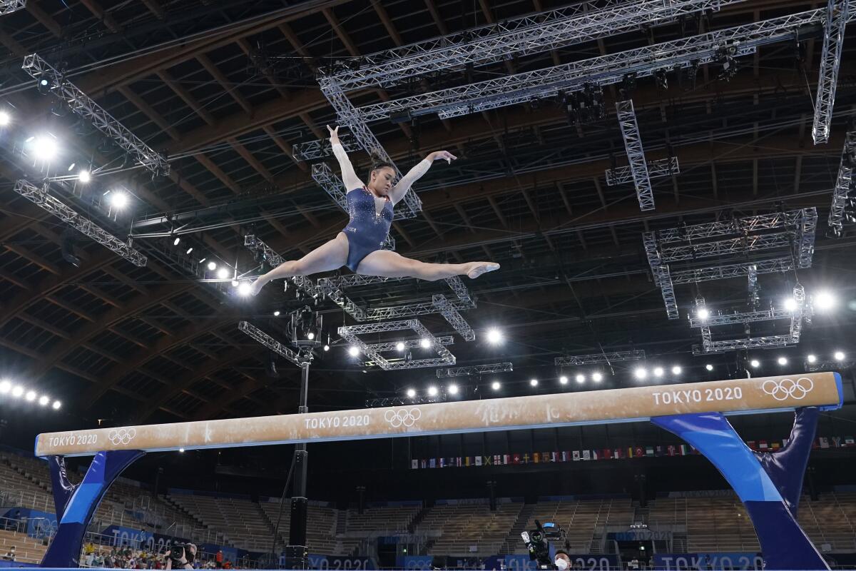 Sunisa Lee performs on the balance beam during the women's all-around final.