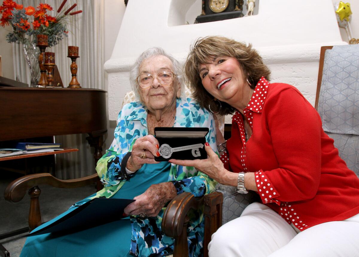 Gertrude Ness, who recently turned 110 years old, received the key to the city from Glendale Mayor Paula Devine, right, at her home in Glendale on Tuesday, June 21, 2016.