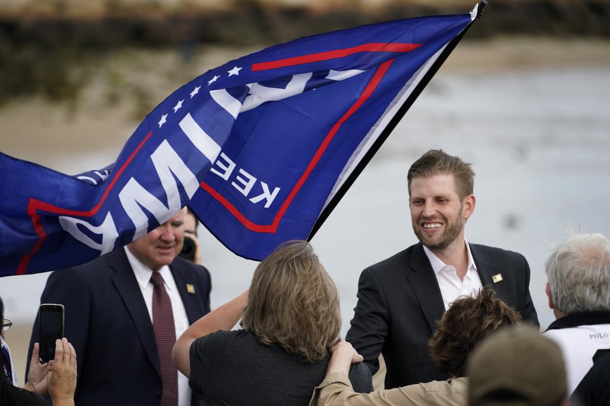 Eric Trump greets supporters at a campaign rally.