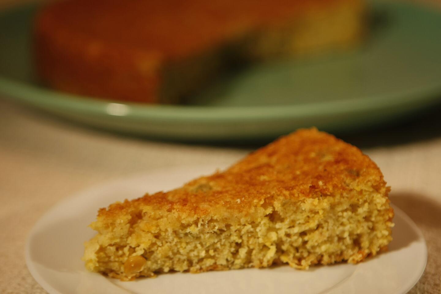 This cornbread is made with cheese and chopped chiles, and then finished off with a drizzle of honey.