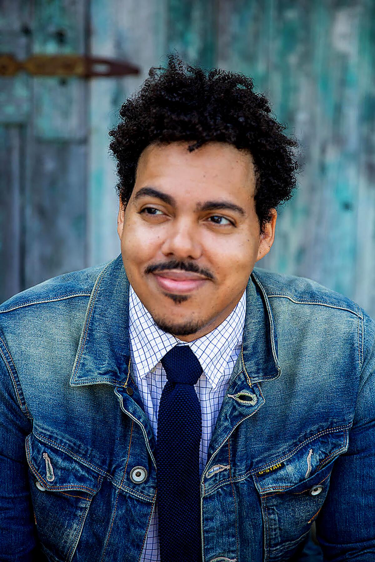 Portrait of a man in a denim jacket 