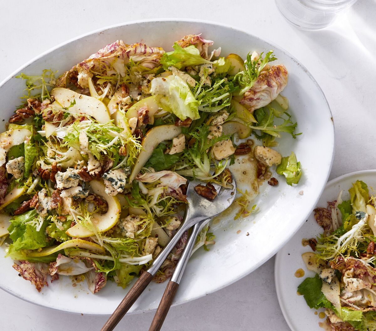 A crisp salad of chicories, frisee and radicchio with blue cheese, pears and pecans.
