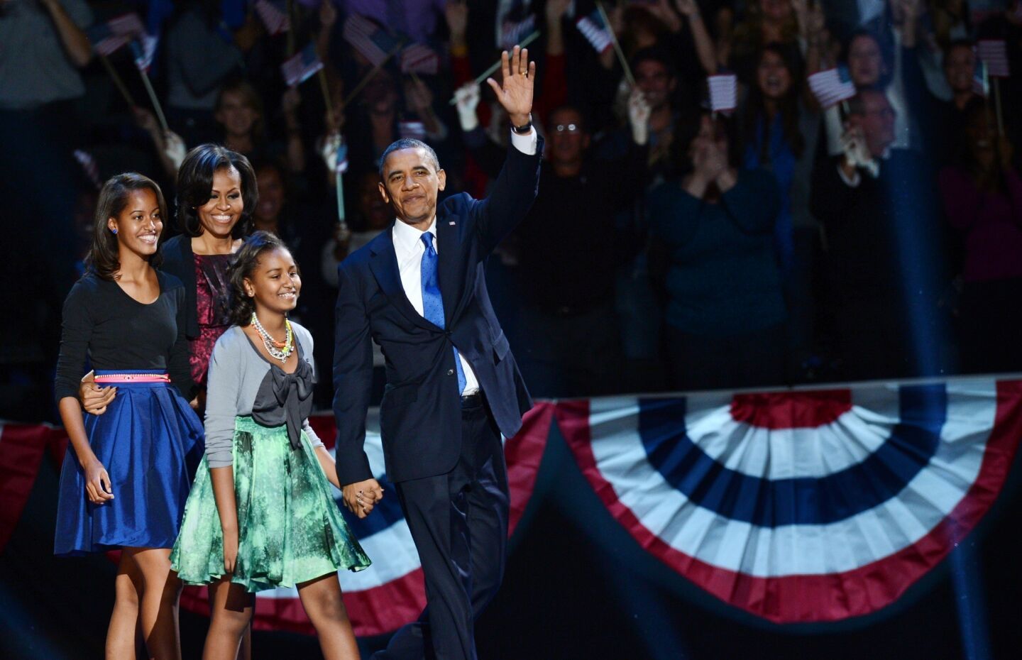 President Obama and his family arrive onstage after his victory in the 2012 presidential election.