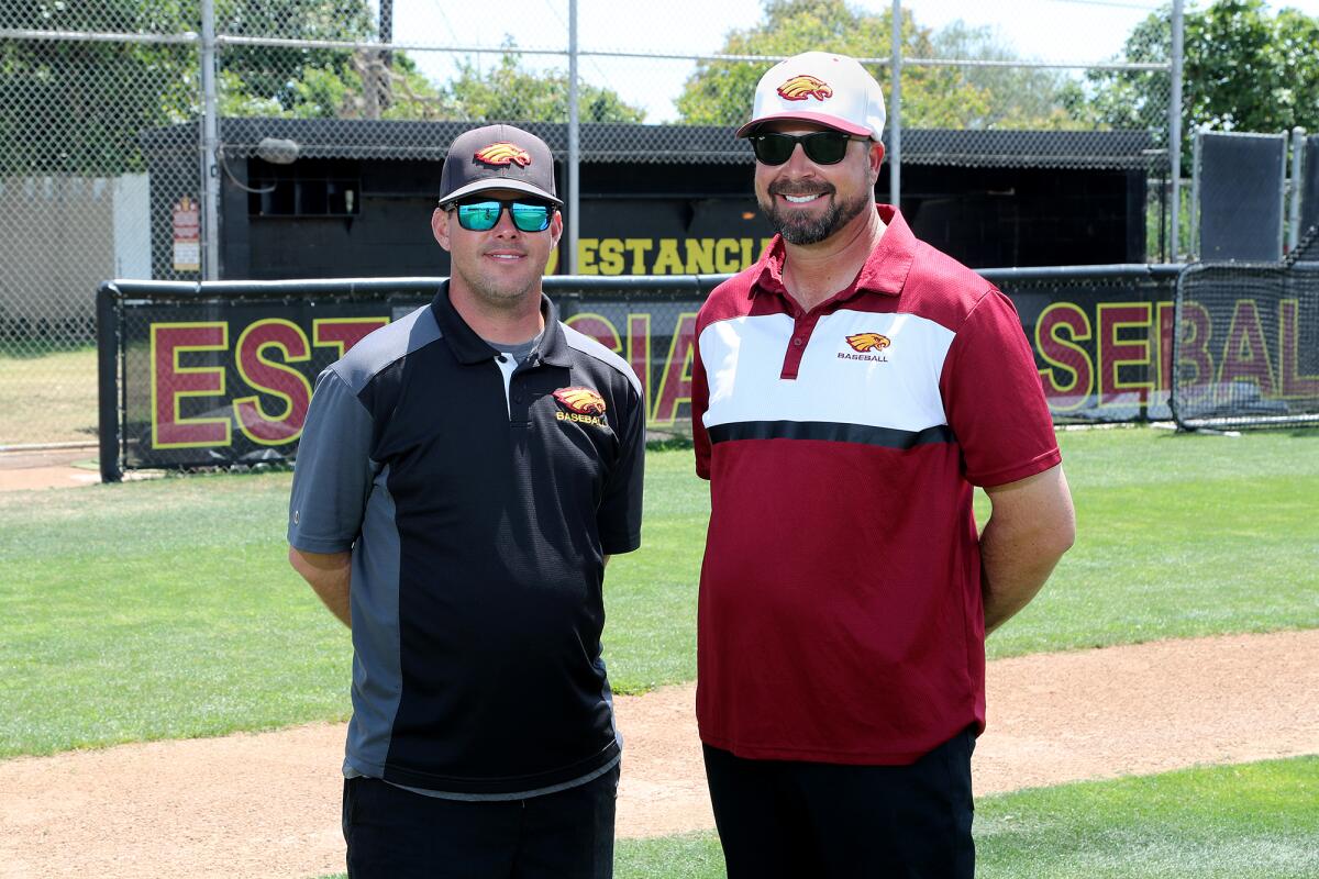 Estancia High baseball assistant coach Ty Harper, right, and head coach Nate Goellrich pose for a portrait.