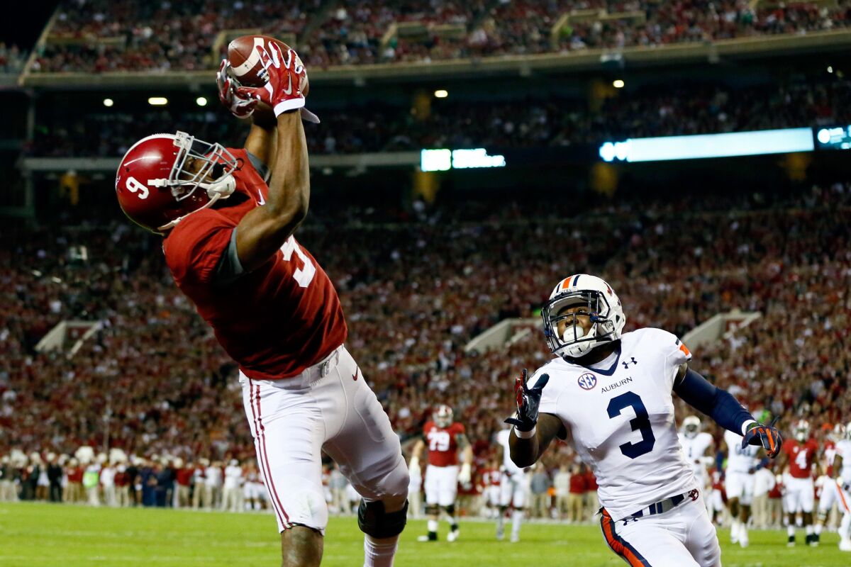 Alabama receiver Amari Cooper catches a 17-yard touchdown pass from quarterback Blake Sims during the first quarter of the Iron Bowl against Auburn on Nov. 29.
