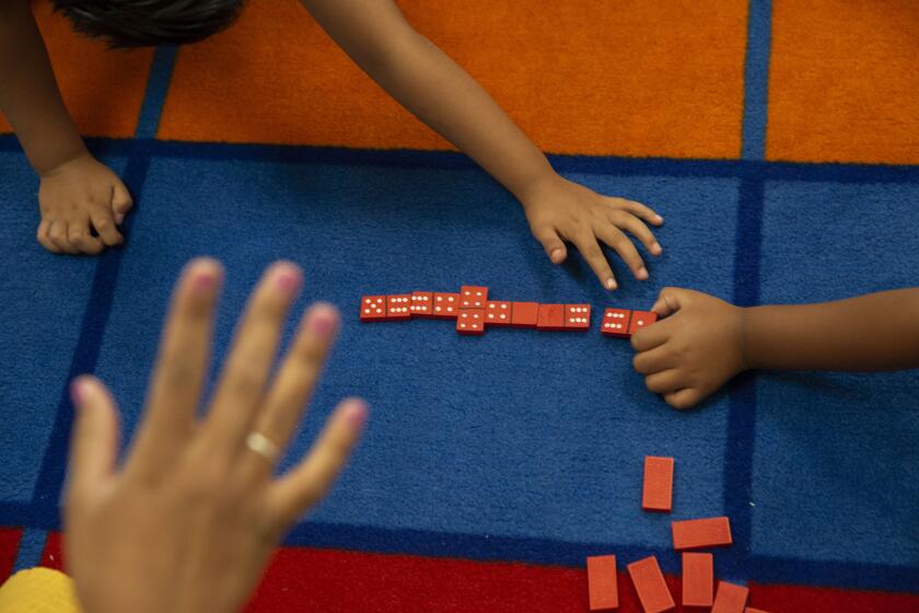 LOS ANGELES, CALIF. - AUGUST 06, 2019: Children play math games at Esperanza Elementary School on Tuesday, Aug. 6, 2019 in Los Angeles, Calif. L.A. Unified is running a new summer program for incoming first graders who are slightly behind academically to ensure they catch up and don't need more interventions and credit recovery when they're older. (Liz Moughon / Los Angeles Times)