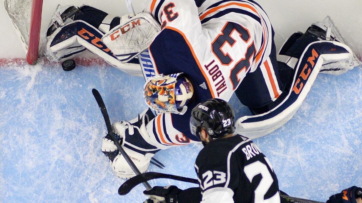 The Kings' Dustin Brown puts the puck past Edmonton goaltender Cam Talbot, but the goal was called back for goalie interference.
