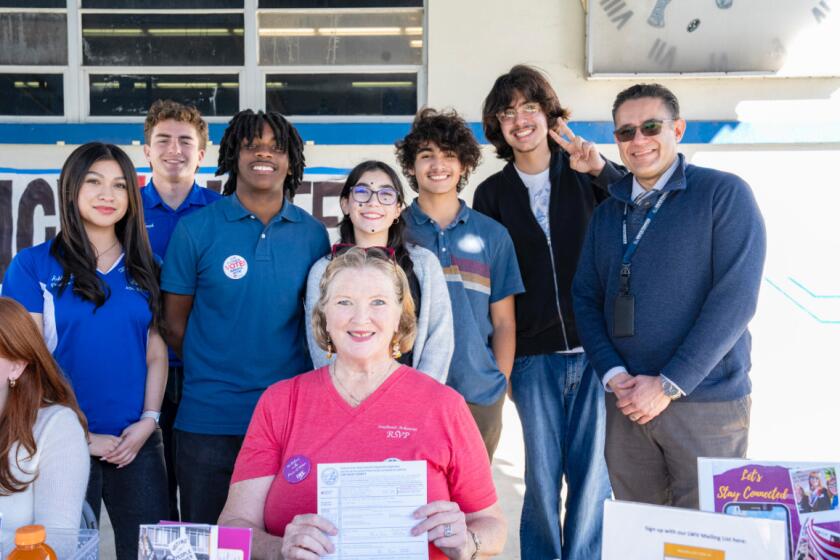 Sweetwater Union High School District board member and former journalist and former city councilwoman in San Diego, Marti Emerald, with students from the Voter Registration Campaign at Chula Vista High School.