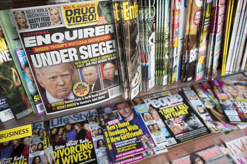 FILE - In this July 12, 2017 file photo, an issue of the National Enquirer featuring President Donald Trump on its cover is displayed on a newsstand in a store in New York. VVIP Ventures is buying the U.S. and U.K editions of the National Enquirer, the tabloid that engaged in “catch-and-kill” practices to bury stories about Donald Trump during his presidential campaign. Financial terms were not disclosed. (AP Photo/Mary Altaffer, File)