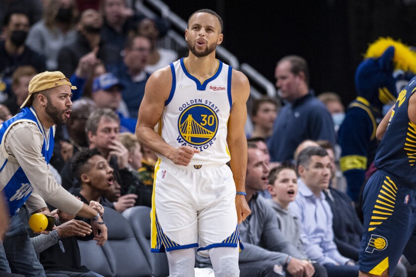 Golden State Warriors guard Stephen Curry (30) reacts after missing a three-point basket during the second half of an NBA basketball game against the Indiana Pacers in Indianapolis, Monday, Dec. 13, 2021. (AP Photo/Doug McSchooler)