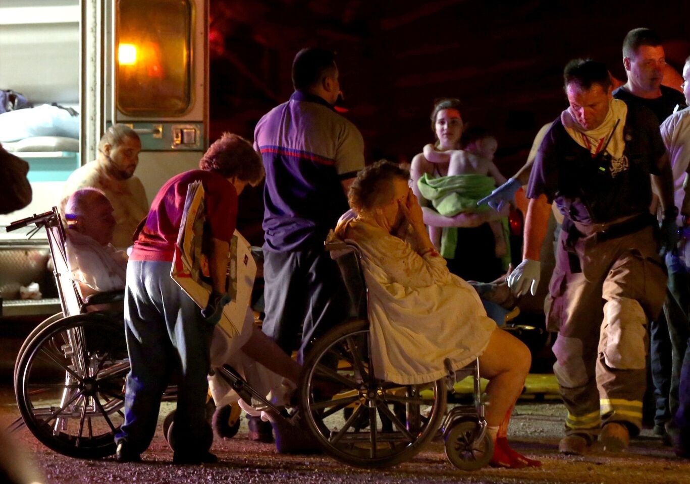 Emergency workers evacuate elderly residents from a damaged nursing home after an explosion at a fertilizer plant in West, Texas.
