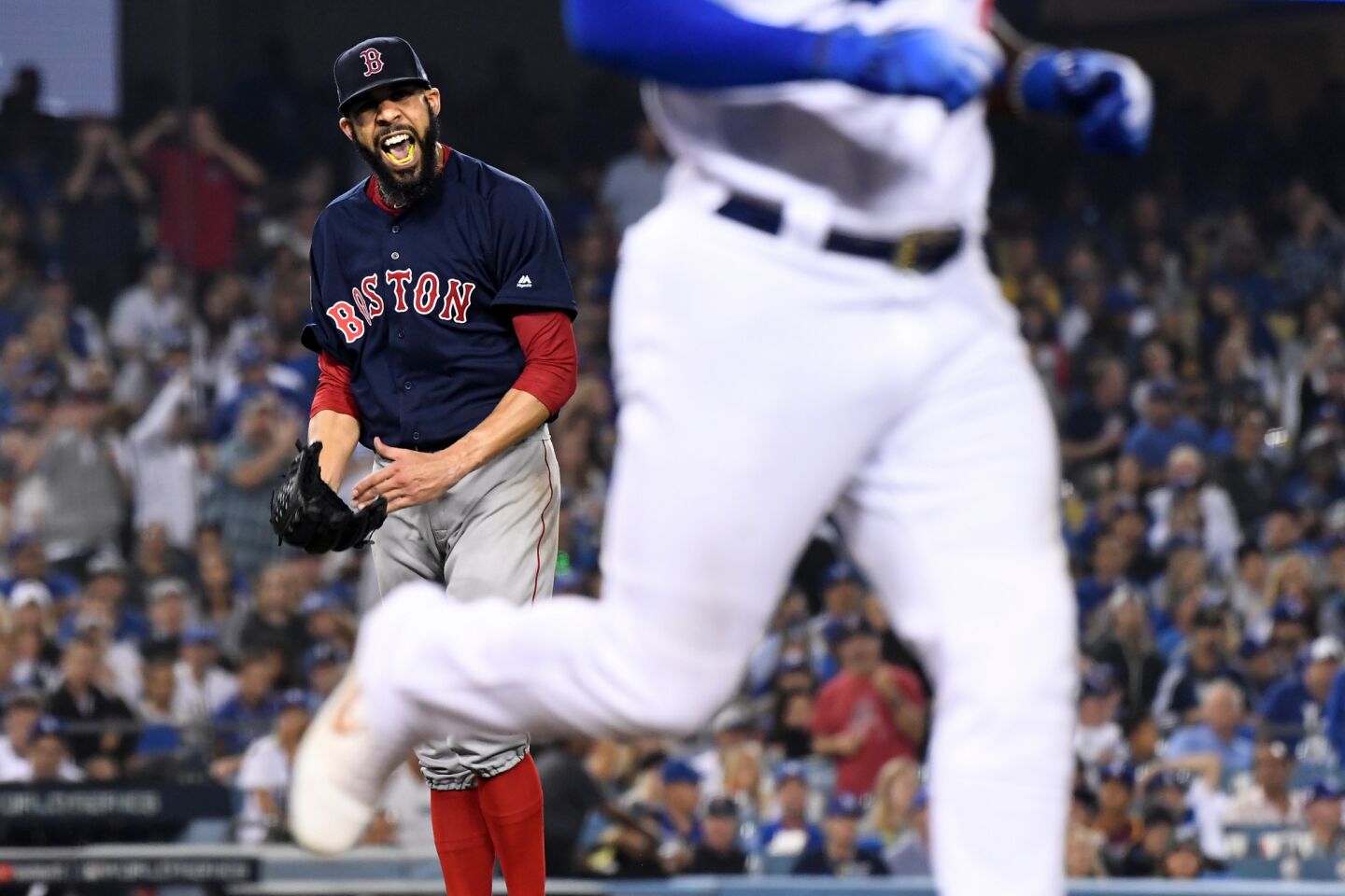 Red Sox starting pitcher David Price reacts after getting Dodgers right fielder Yasiel Puig to ground out in the seventh inning.