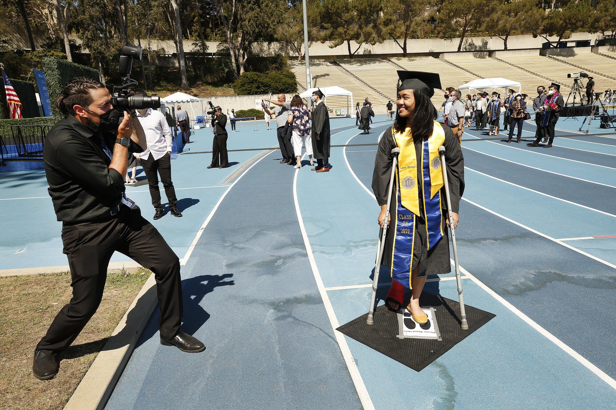 Sophia Bautista, 22, graduating with a degree in Political Science and Labor Studies is on crutches 