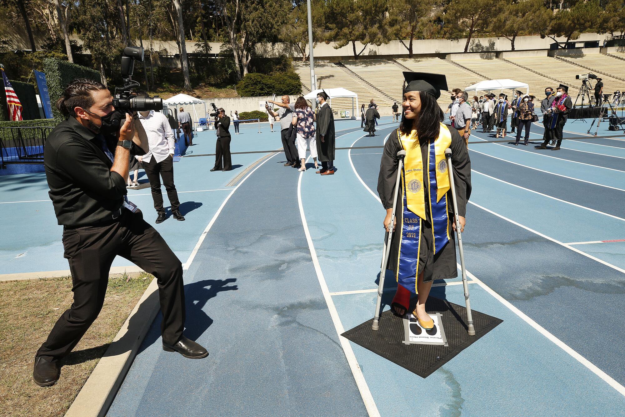 Sophia Bautista, 22, graduating with a degree in Political Science and Labor Studies is on crutches