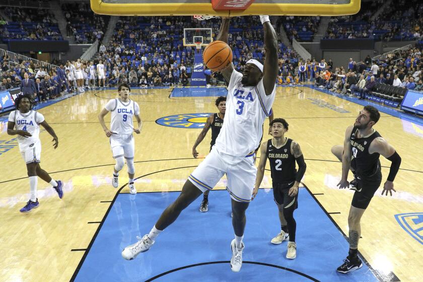 UCLA forward Adem Bona (3) dunks the ball against Colorado during the first half of an NCAA college basketball game Thursday, Feb. 15, 2024, in Los Angeles. UCLA won 64-60. (AP Photo/Raul Romero Jr.)