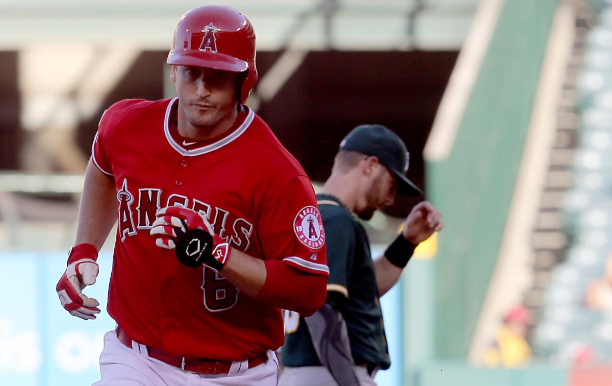 Angels third baseman David Freese rounds the bases after hitting a solo home run against the Oakland Athletics on Wednesday during the fourth inning.
