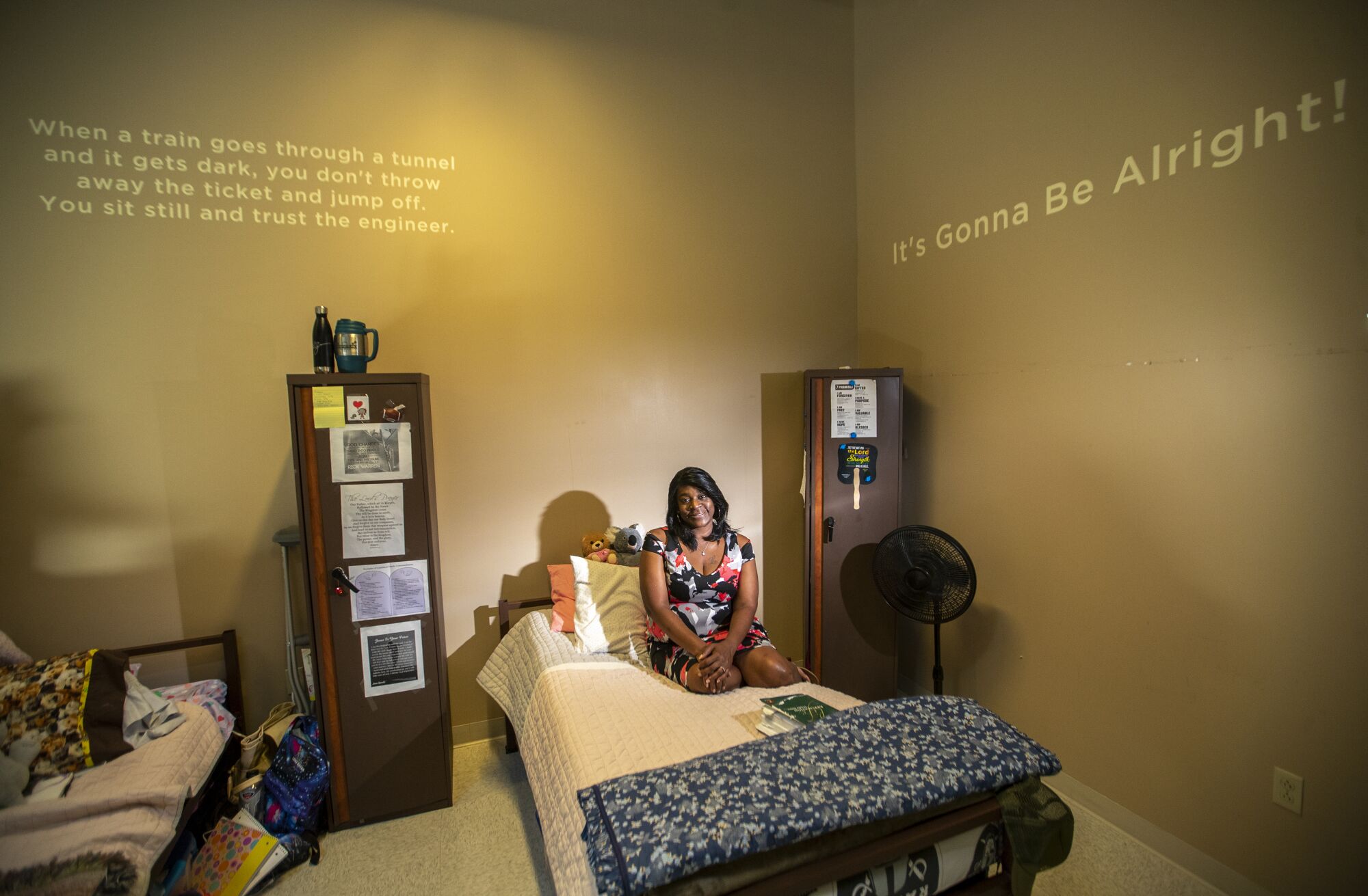 Charlotte Oliver is shown taking a break from reading her Bible in her room at the Coachella Valley Rescue Mission (CVRM).