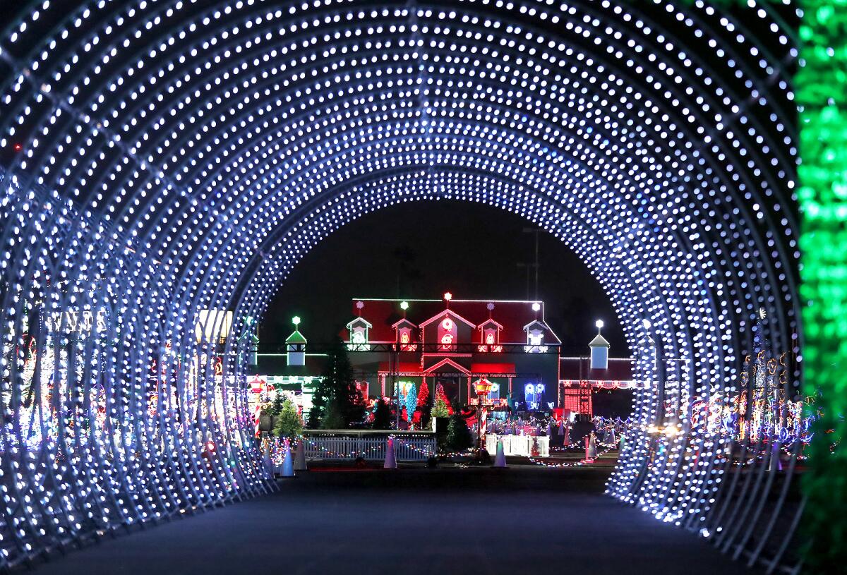 A view through one of the light tunnels of the North Pole during Night of Lights OC at the O.C. fairgrounds in Costa Mesa.