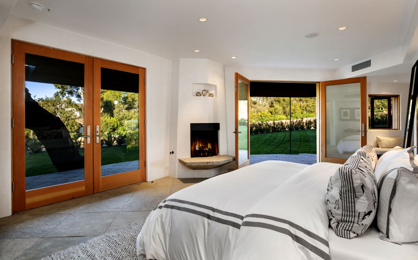 A master suite with an adjoining den is among the house's four bedrooms.
