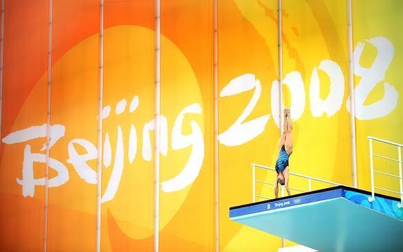 A diver prepares for her jump during practice on the 10-meter platform, four days before the start of the 2008 Olympic Games in Beijing. Chinese and American divers are expected to dominate the competition.