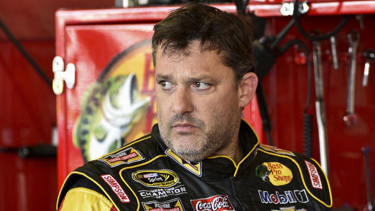 Tony Stewart looks in the garage area during a practice session at Watkins Glen International on Friday.