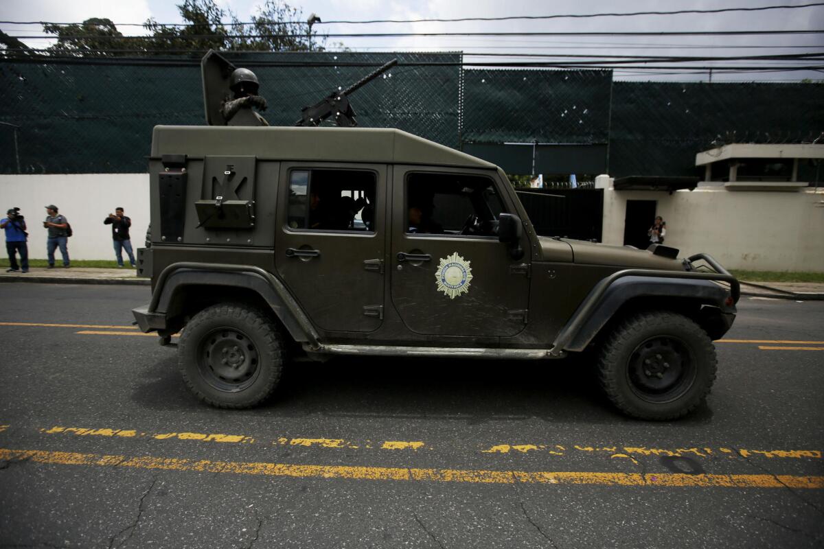 Armed units of the National Civil Police of Guatemala cruise past the headquarters of the International Commission against Impunity in Guatemala after President Jimmy Morales announced he was shutting down the commission.