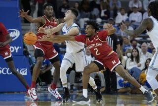 Maryland guard Jahari Long (2) knocks the ball from the hands of UCLA guard Lazar Stefanovic.