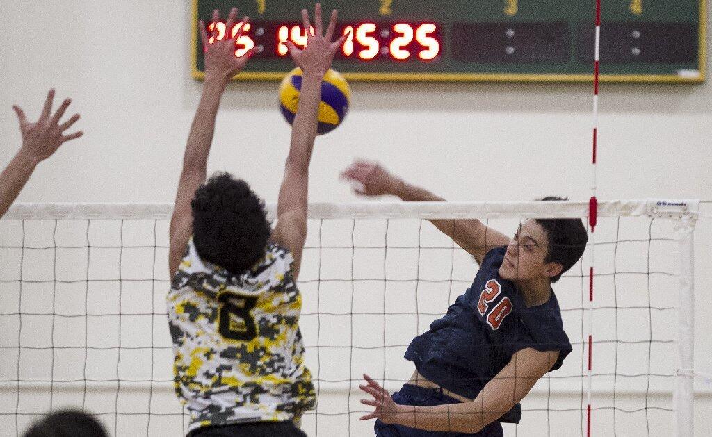 Orange Coast College's Justin Kam hits into Golden West College's Shilo Chow.