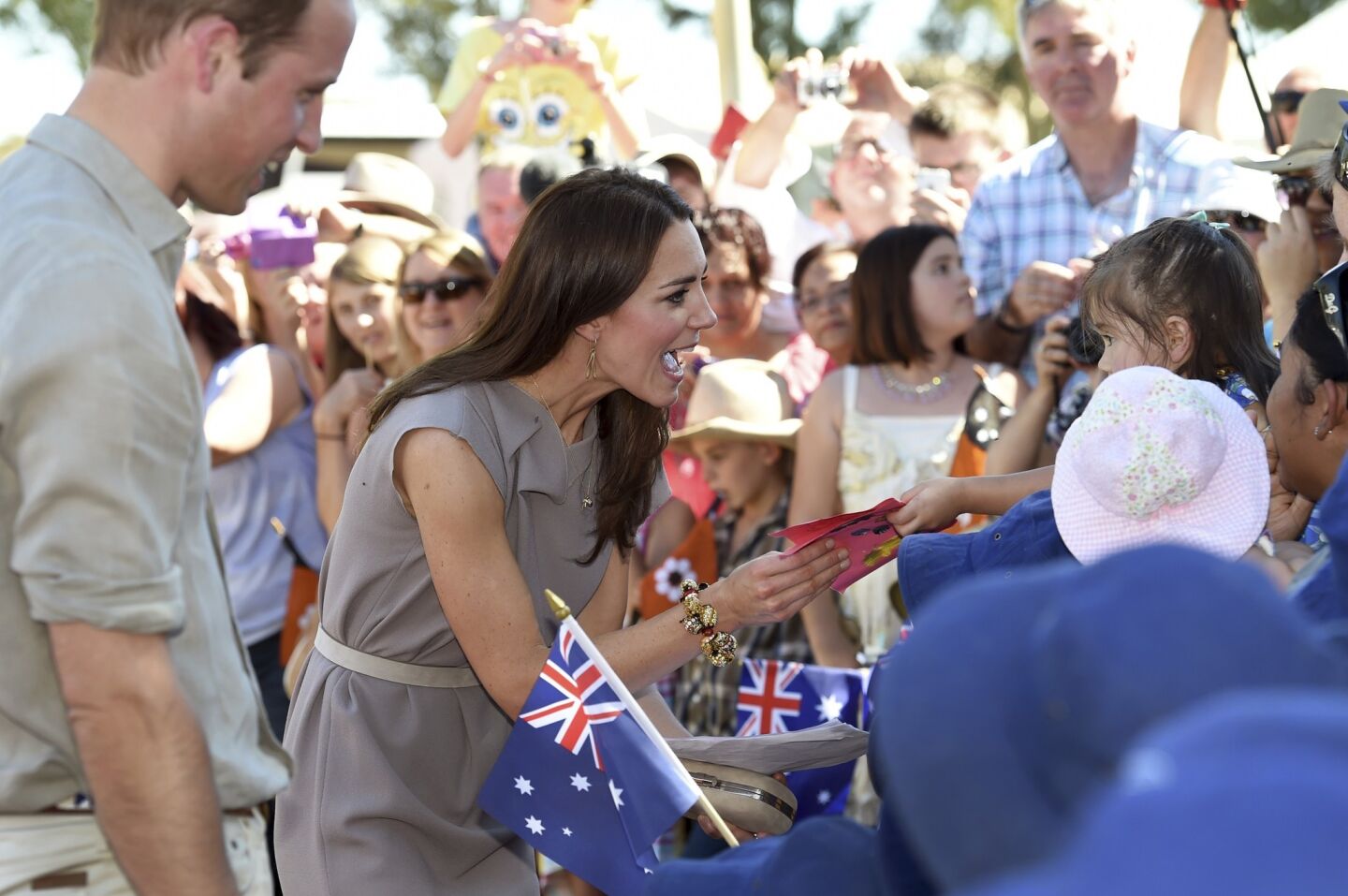 The royals speak to locals during a visit to the National Indigenous Training Academy at Uluru, Australia,
