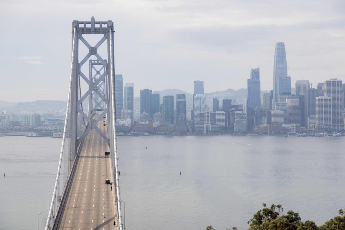 Police are the only figures on an empty Bay Bridge.