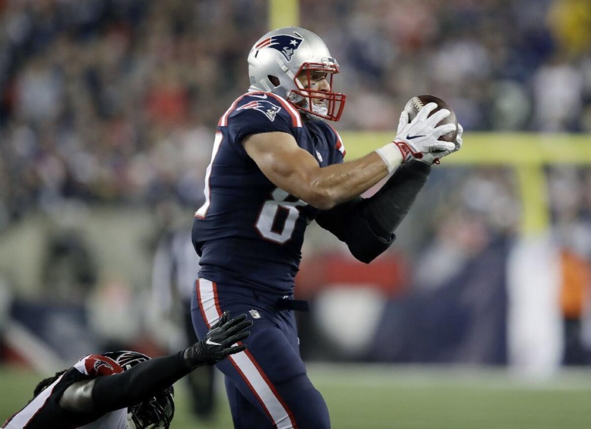 Patriots tight end Rob Gronkowski catches a pass against the Falcons during the first half of a game on Oct. 22.