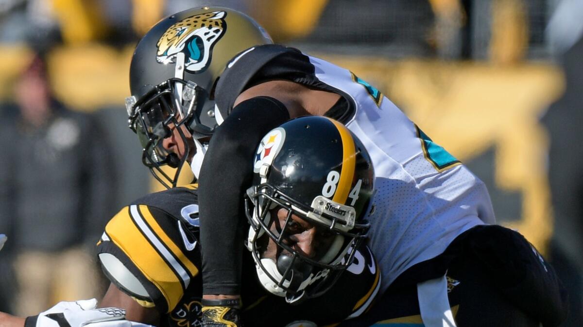 Jacksonville cornerback Jalen Ramsey, top, tackles Pittsburgh receiver Antonio Brown on Sunday.