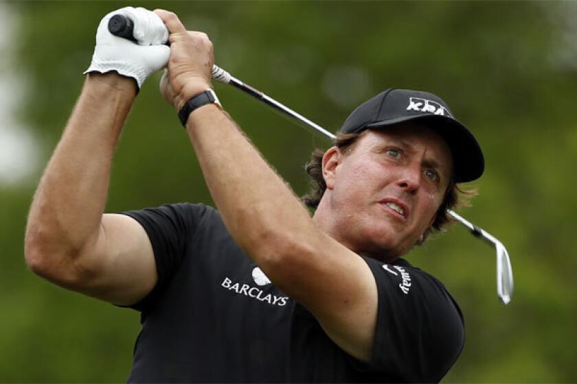 Phil Mickelson watches his tee shot on the ninth hole during the first round of the Shell Houston Open at the Golf Club of Houston on Thursday.