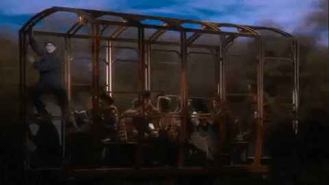 A GIF of the cast of “Anastasia” in a rotating railcar against a moving backdrop.