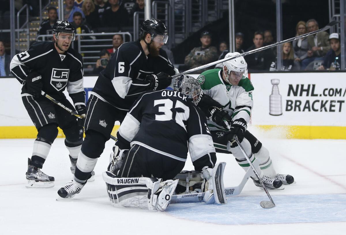 Stars forward Valeri Nichushkin, right, tries to get around Kings goalie Jonathan Quick and defensemen Jake Muzzin and Alec Martinez defend during April 2.