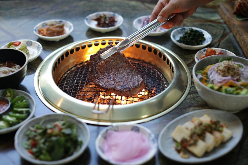 LOS ANGELES, CA -- OCTOBER 31, 2019: A ribeye on the grill at Jeong Yuk Jeom in Koreatown. The restaurant, whose name means butcher shop or meat specialist in Korean, specializes in high-end meats. (Myung J. Chun / Los Angeles Times)