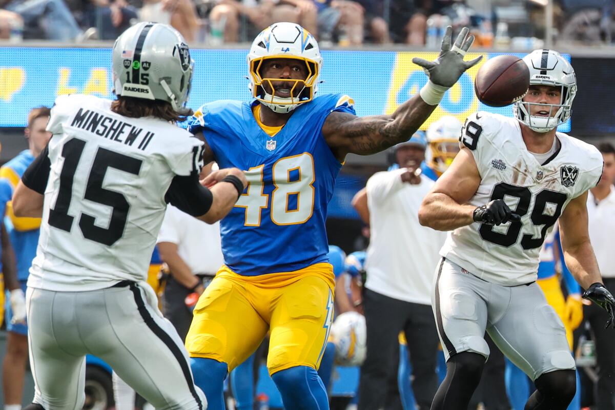 Chargers linebacker Bud Dupree deflects a pass thrown by Las Vegas Raiders quarterback Gardner Minshew.