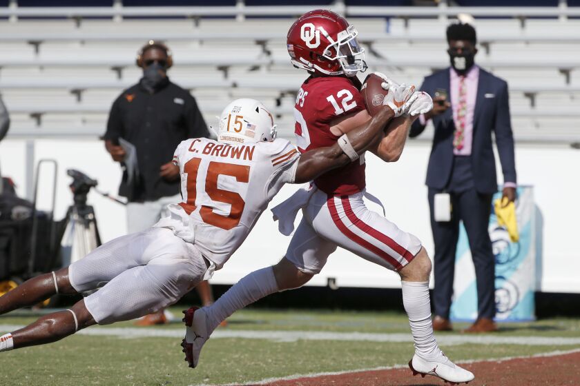 Oklahoma wide receiver Drake Stoops (12) scores the winning touchdown in overtime.