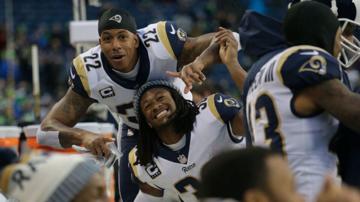 Rams' Trumaine Johnson (22) and Todd Gurley (30) goof around on the sideline during a game against the Seattle Seahawks on Dec. 17.