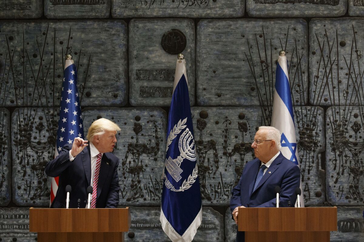 Israeli President Reuven Rivlin listens as President Trump speaks in Jerusalem in May.