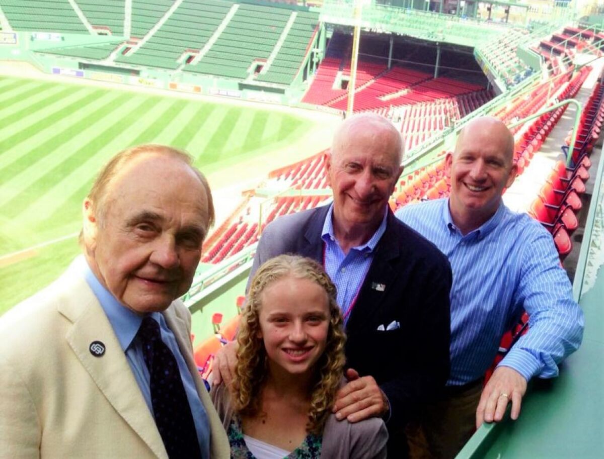 Sportscaster Dick Enberg joins George Mitrovich (in navy), his son Tim Mitrovich and George's granddauaghter Juliette.