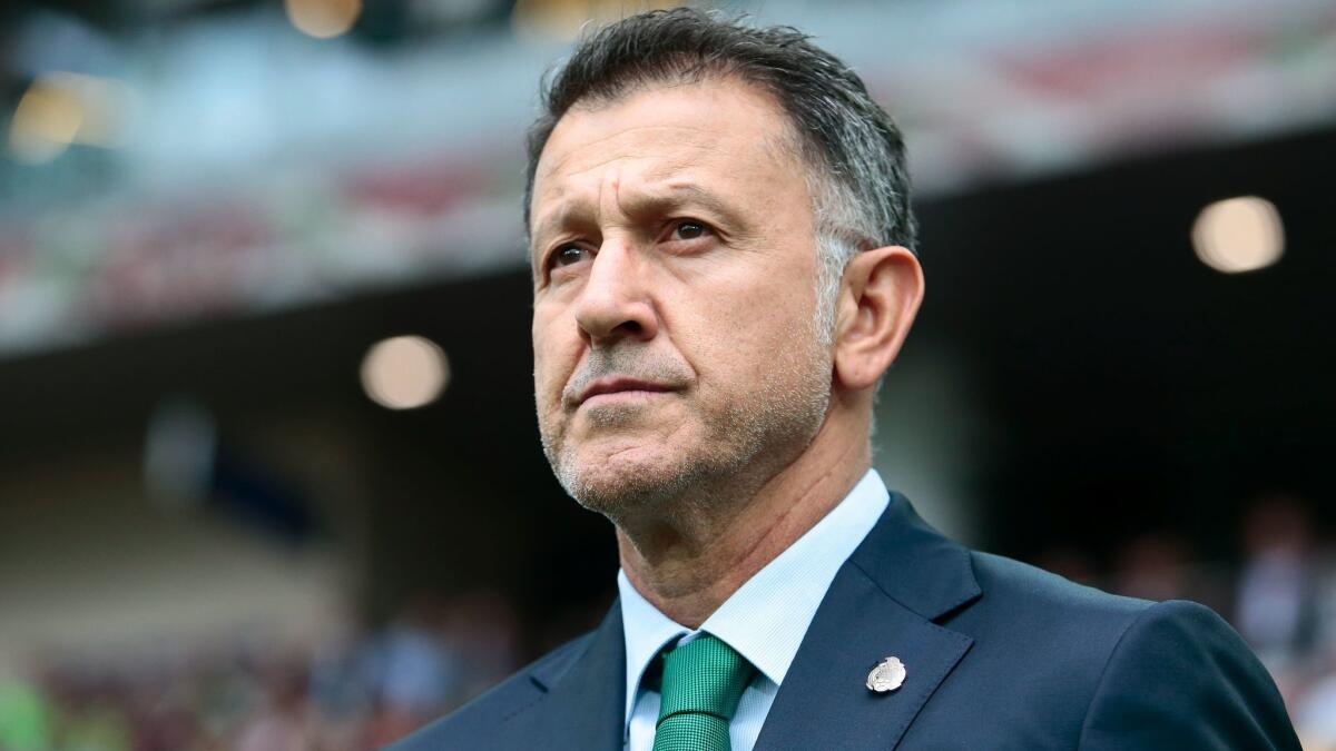 Mexico Coach Juan Carlos Osorio waits for the start of a Confederations Cup game against Portugal on Sunday.