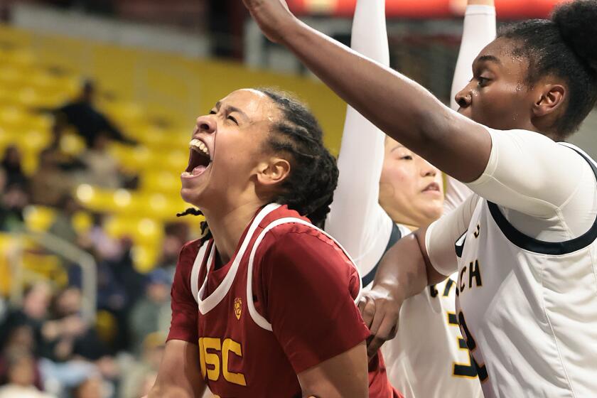 Long Beach, California December 21, 2023- USC's McKenzie Forbes drives past.