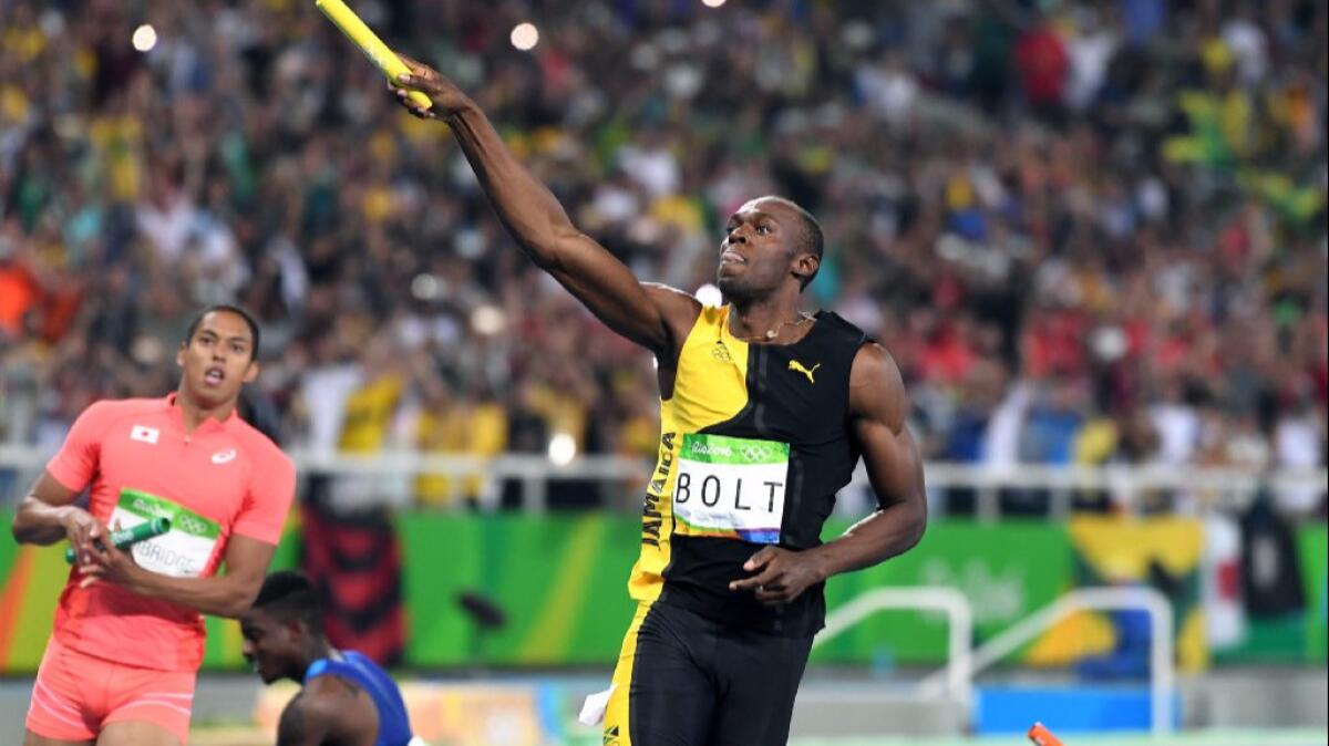 Usain Bolt of Jamaica celebrates after winning the gold medal in the men's 400-meter relay on Aug. 19.