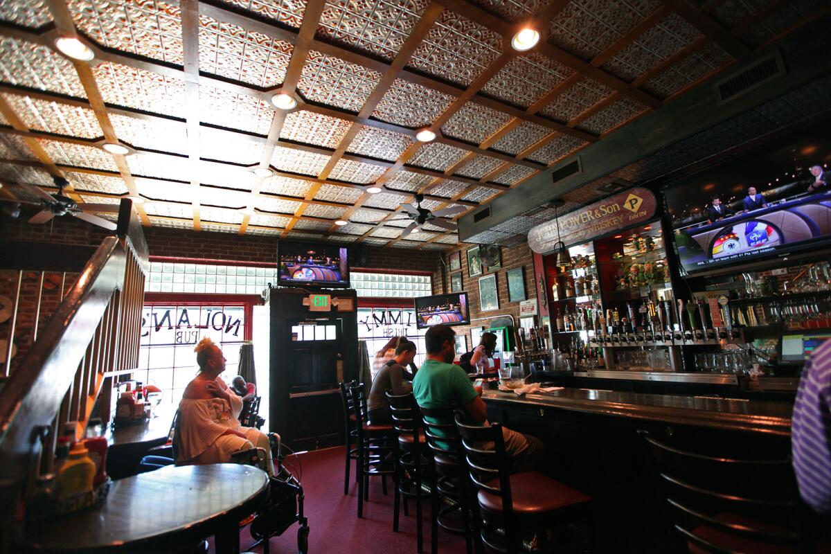 The lunch crowd at Timmy Nolan's Tavern and Grill in Toluca Lake relaxes after a soccer match on Thursday, July, 2016.