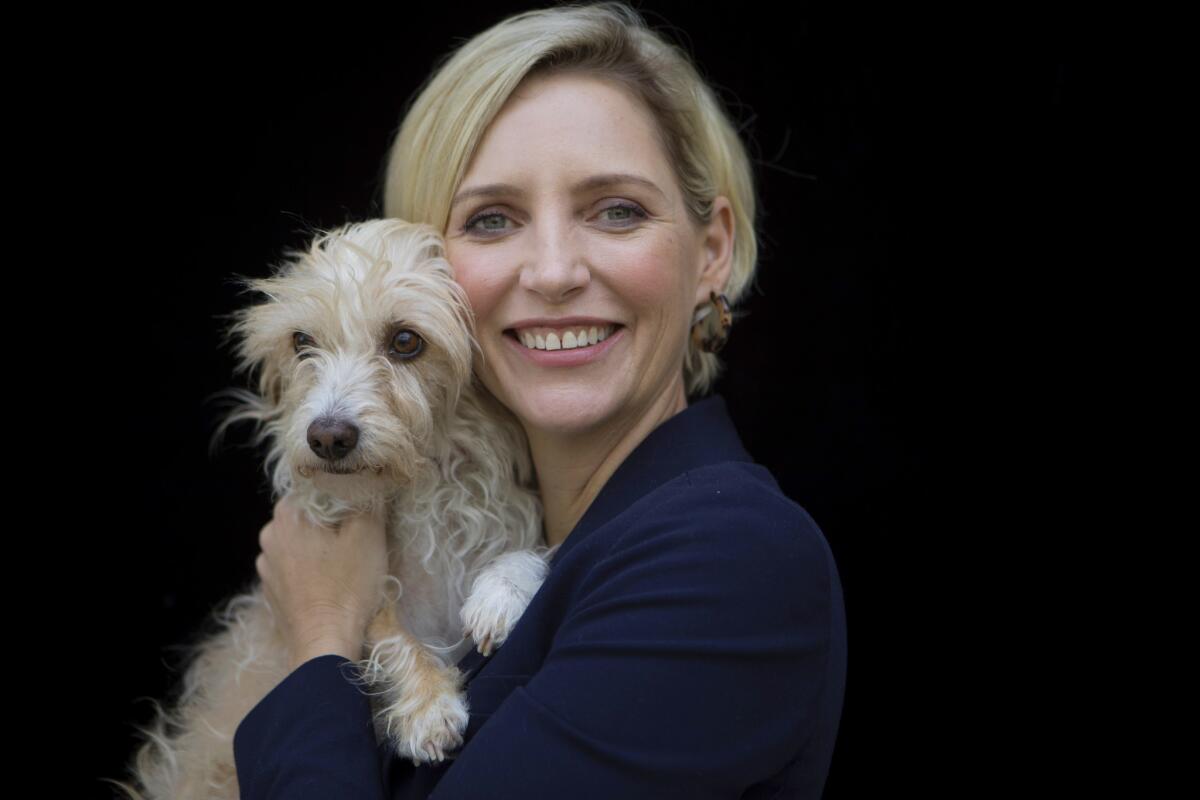 The dog stays in the picture: "Boundaries" director Shana Feste with Loretta, who is not only her pet but a featured canine in the film.